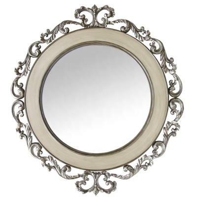 Modern decorative cast metal ornament shaped w/ antique finish with silver finish mirror