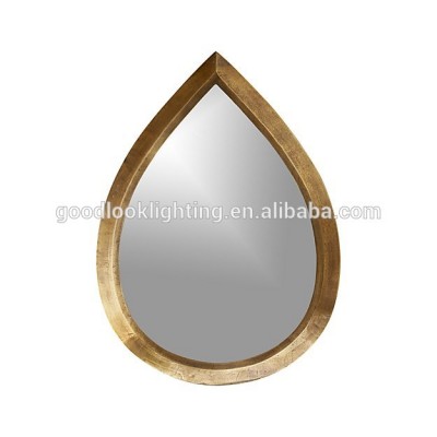 Modern cast metal tear drop shaped antique brass finish with silver mirror